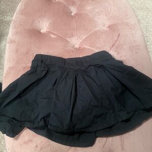 Black skirt shorts underneath